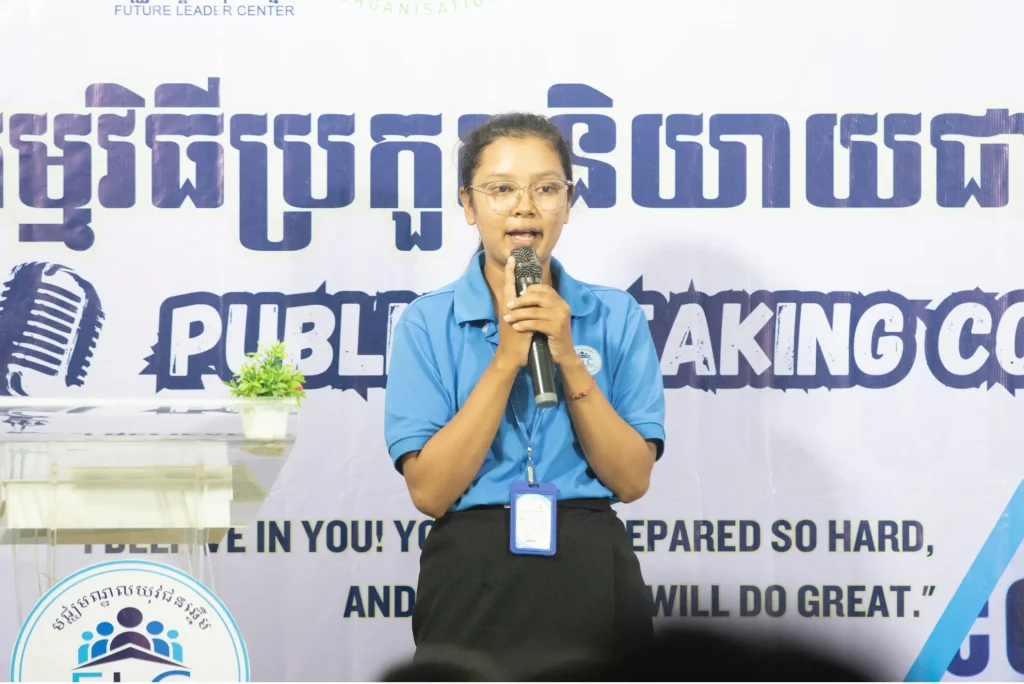 veasna socheata Veasna Socheata holding a microphone with both hands during an FLC public speaking contest.